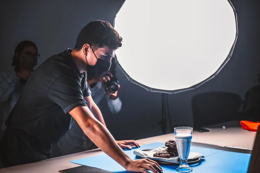 Creative team photographing a product in a commercial studio